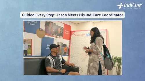 A candid moment showing Jason being guided by an IndiCure coordinator at Wockhardt Hospital, illustrating the personalized support provided during his medical journey.